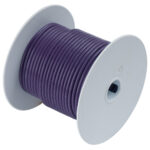 Purple electrical wire spool, close-up view.