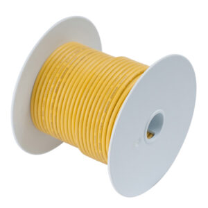 Yellow electrical wire spool on white background.