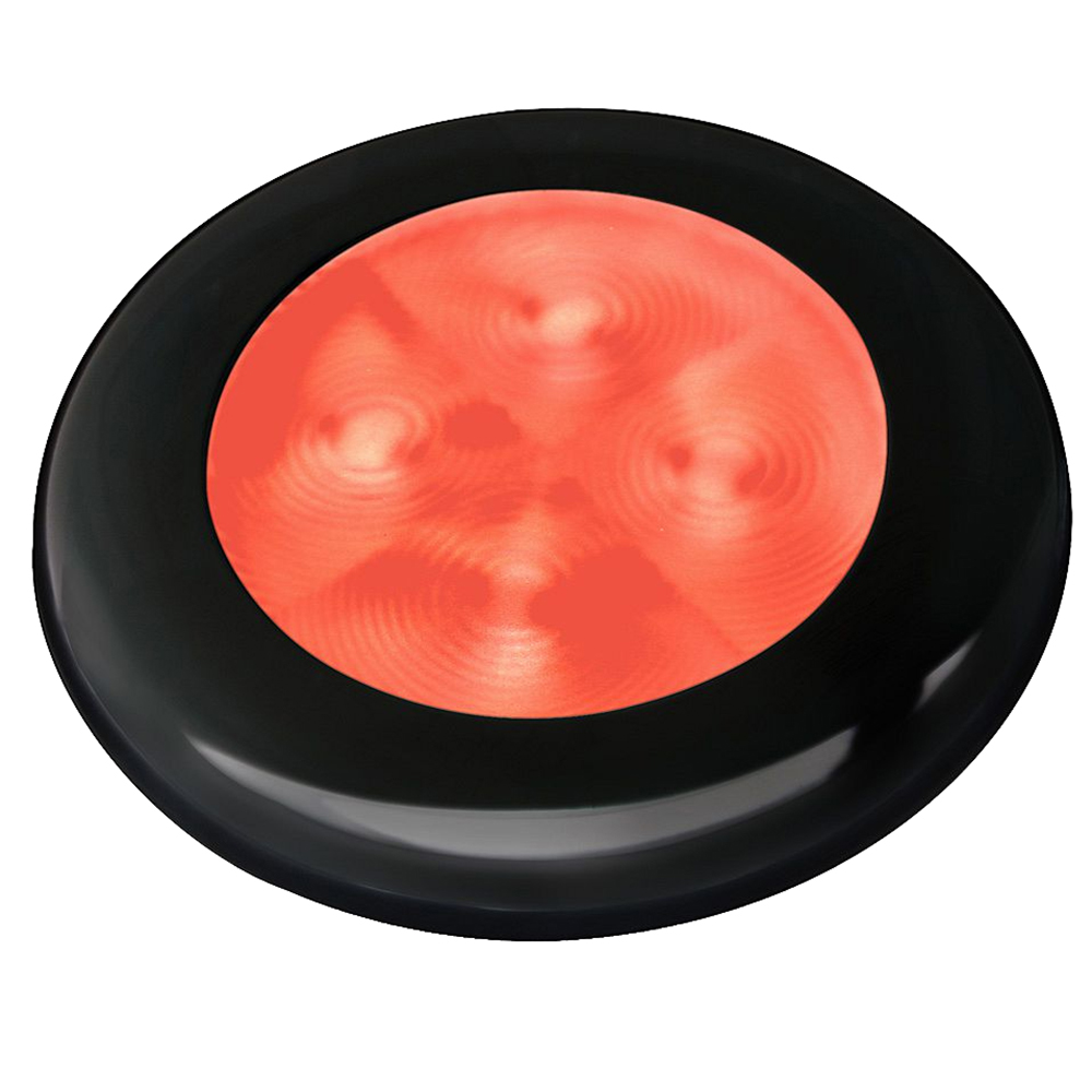 Red wireless call button with black rim.
