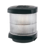 Marine navigation light with black top and base.