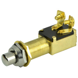 Gold push-button starter switch with metal threads.