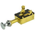 Brass push button fastener with threaded bolt.