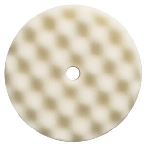 Circular foam buffing pad with center hole.