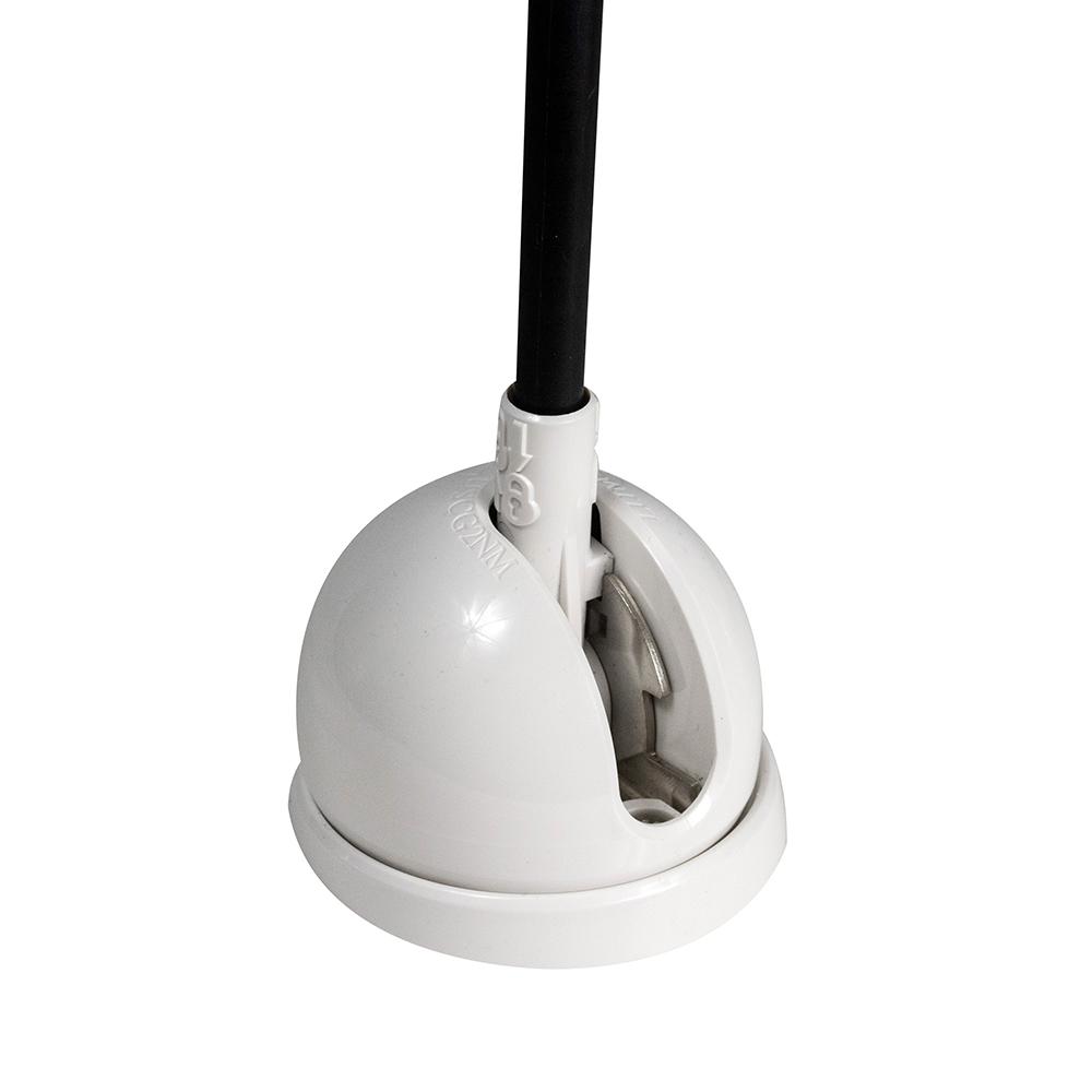 White floor cable cover with black cable inside.