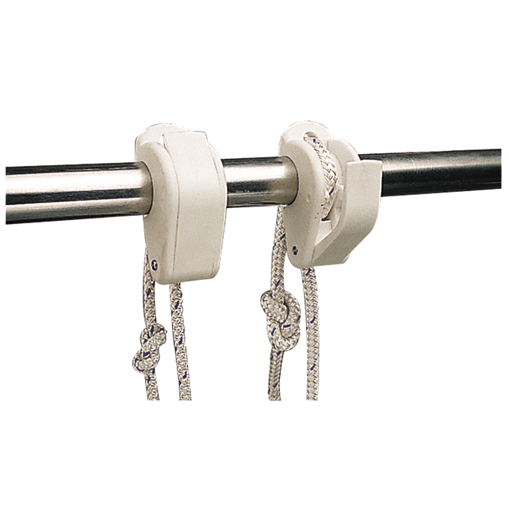 Boat cleats holding ropes on rail