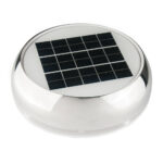 Round solar panel with metallic base.