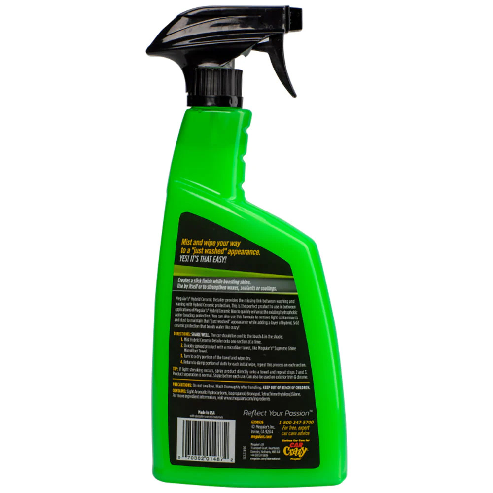 Green spray bottle with cleaning instructions.
