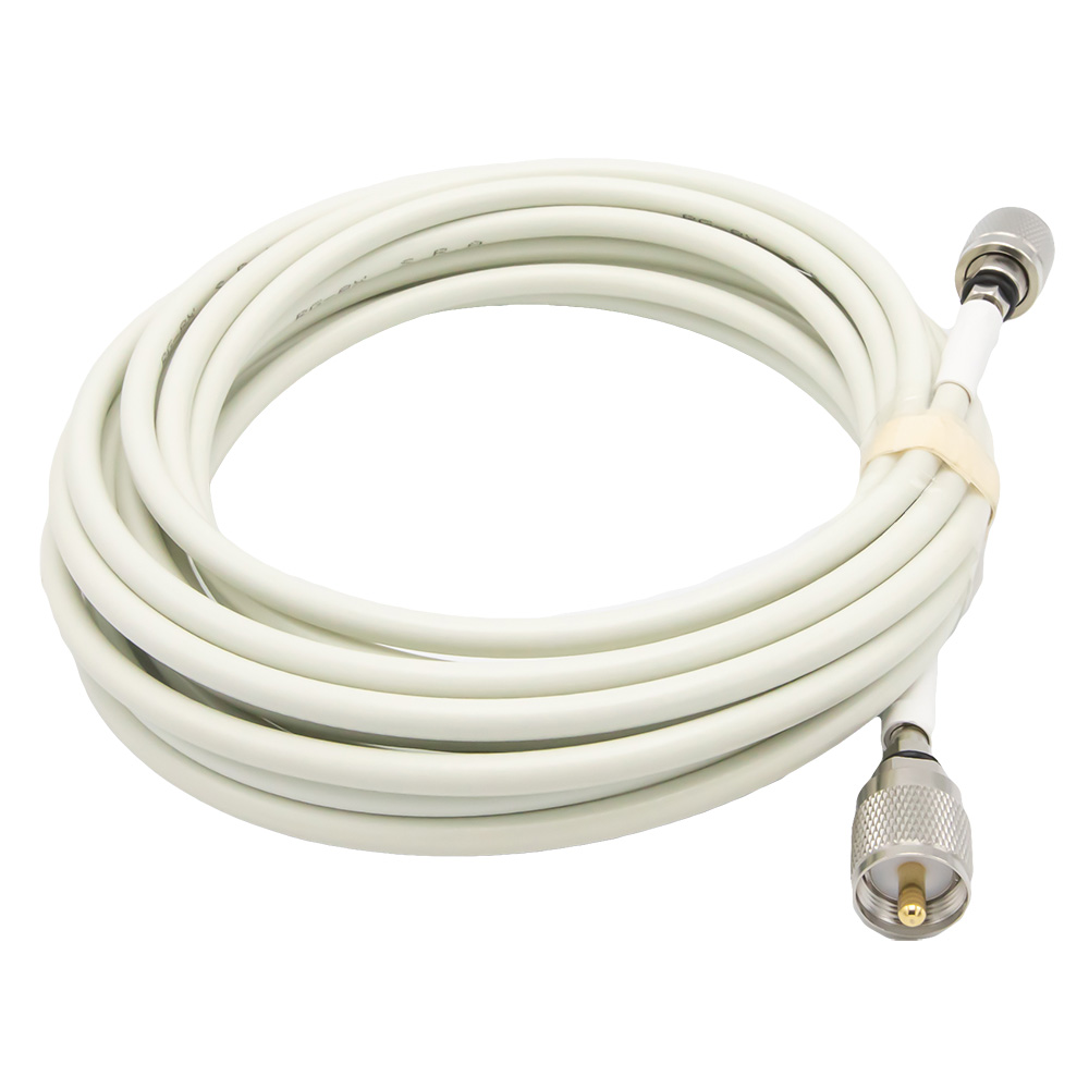 Coiled white coaxial cable with connectors.