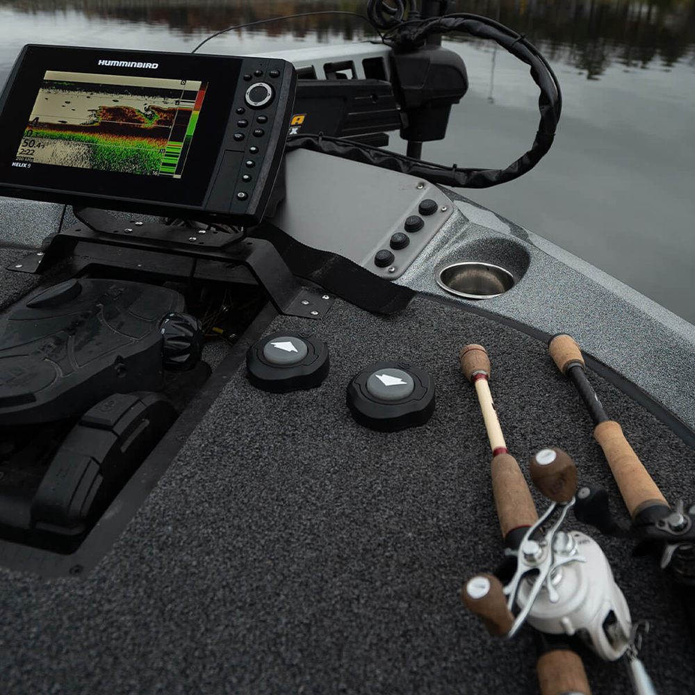 Fishing boat with sonar and rods on deck.