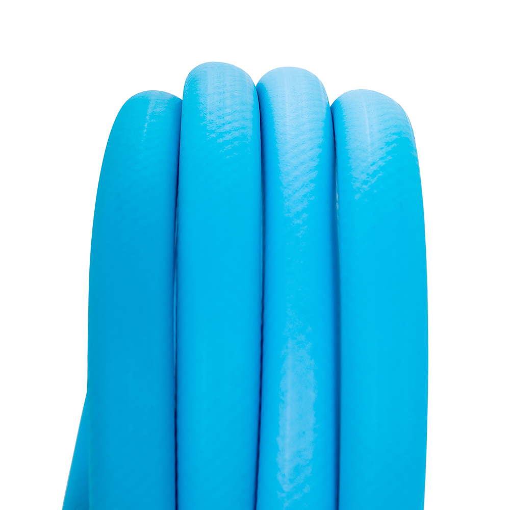 Coiled blue garden hose close-up