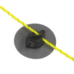 Yellow rope through a circular black cleat.
