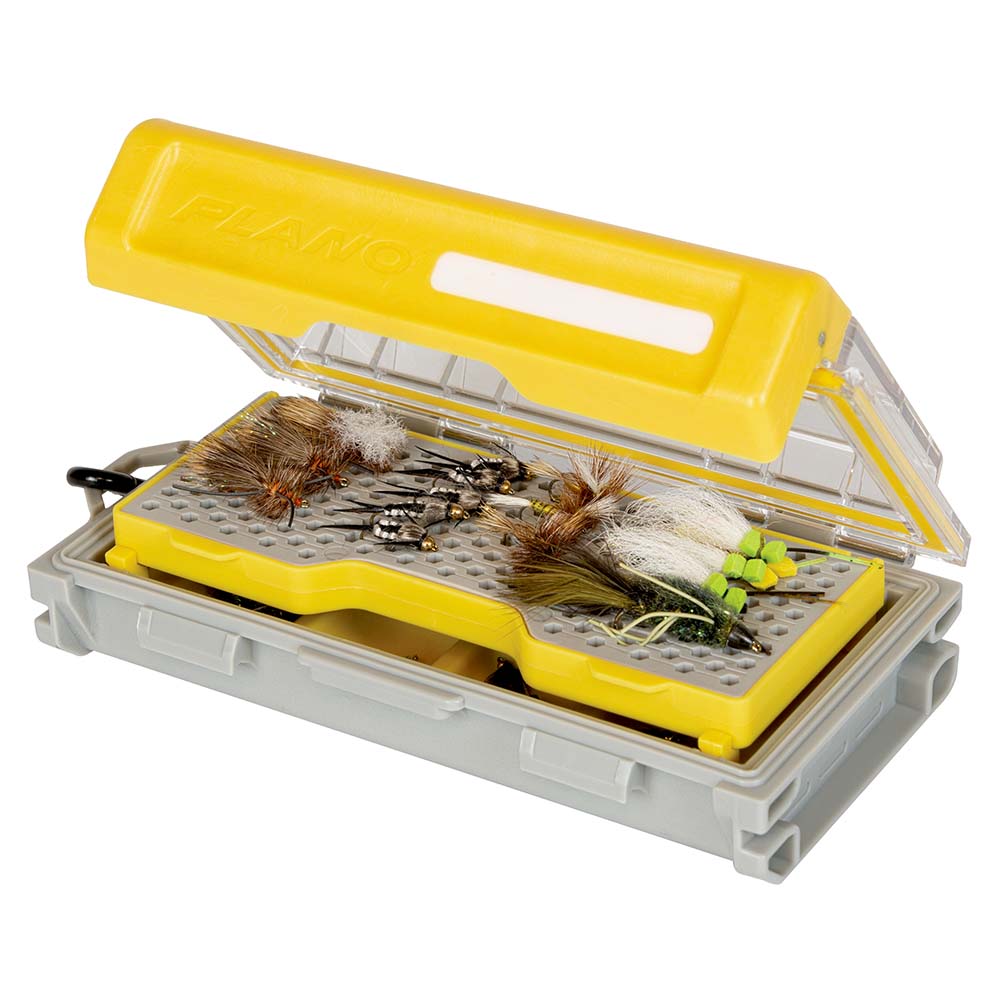 Fishing tackle box with various artificial flies.