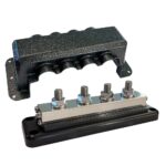 Metal junction block with cover, four terminals visible.