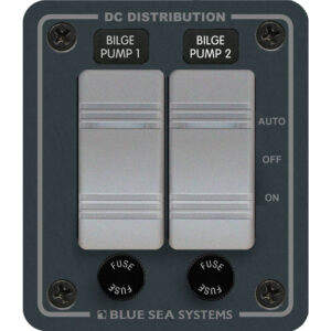 Dual bilge pump control panel with switches and fuses.
