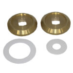 Two brass washers and white rings on display.