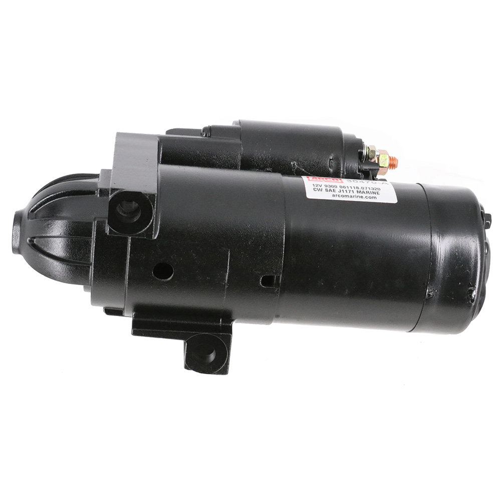 Black vehicle starter motor isolated on white background.