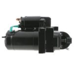 Black automotive starter motor on white background.