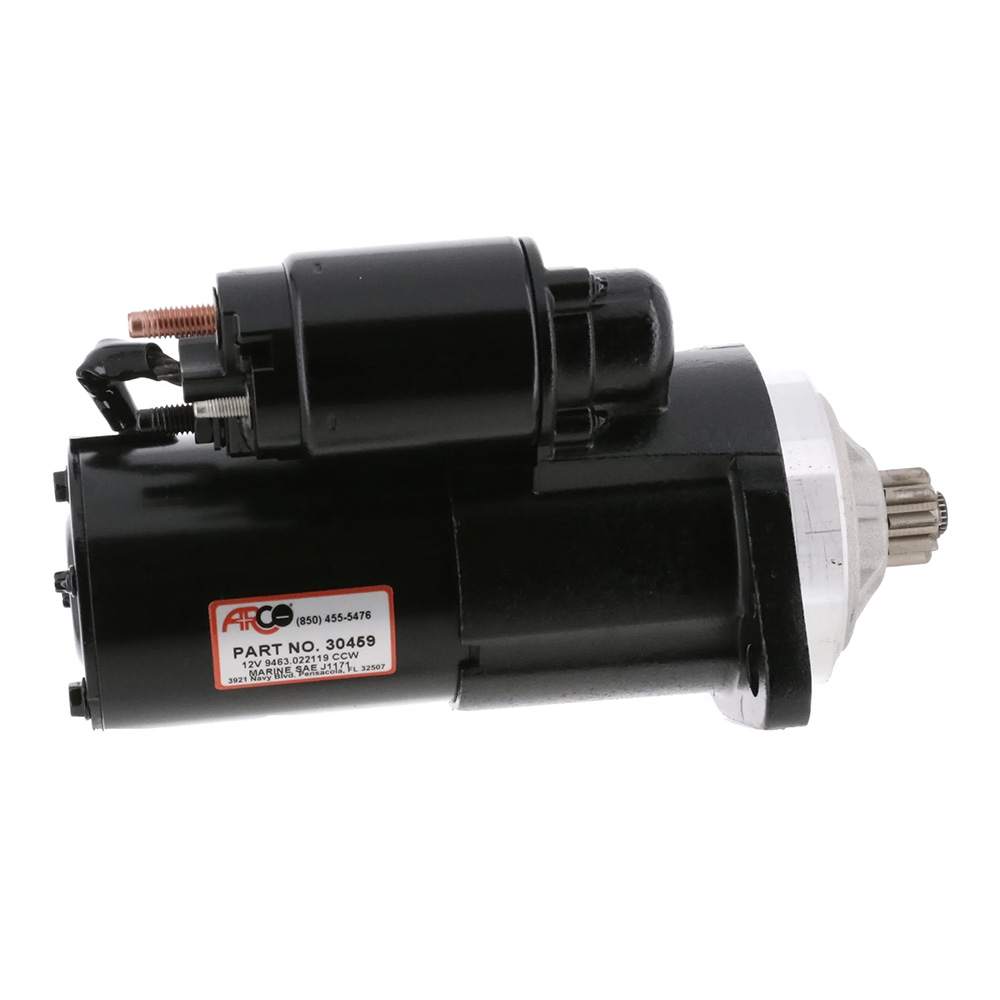 Black automotive starter motor with label.