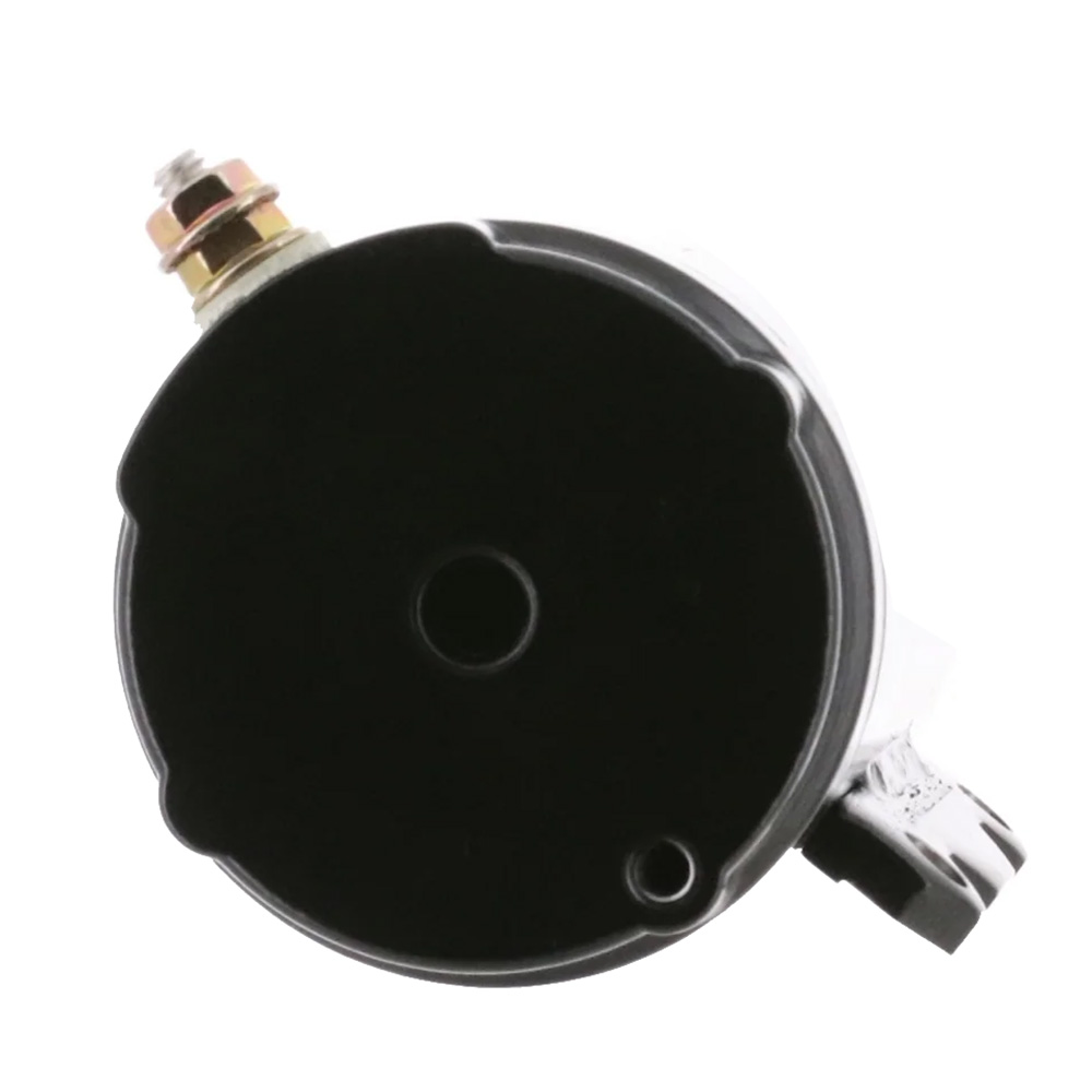 Black circular auto gauge with metal connectors.