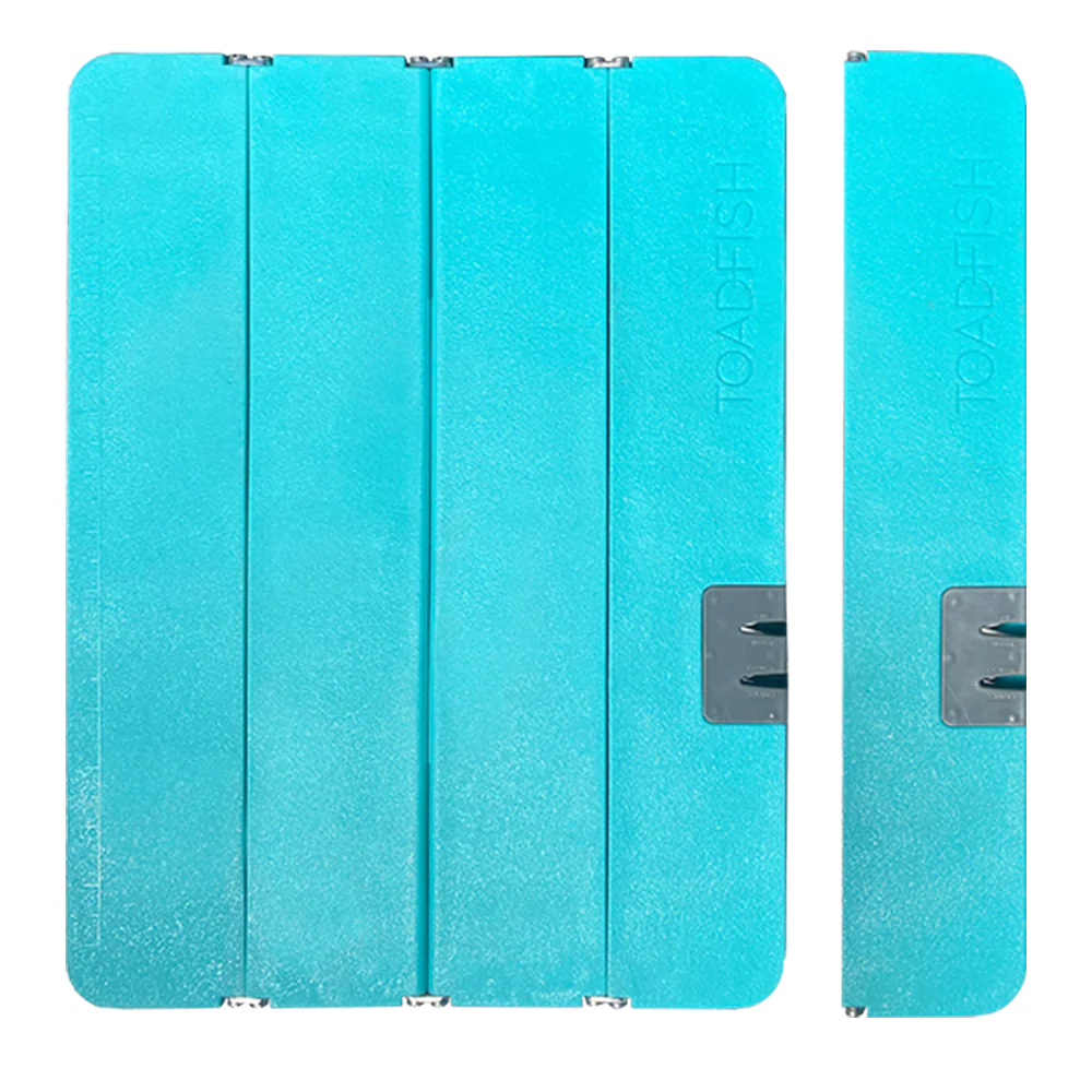 Foldable teal cutting board with knife sharpener.
