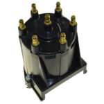 Black car distributor cap with terminals.