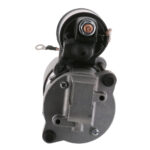 Automotive starter motor, close-up view.