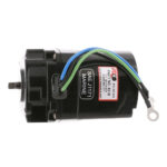 Black marine motor with colorful wires.