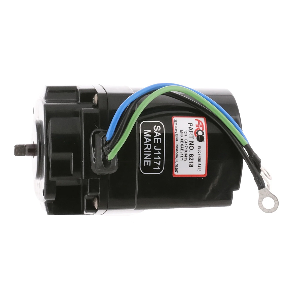 Black marine motor with colorful wires.