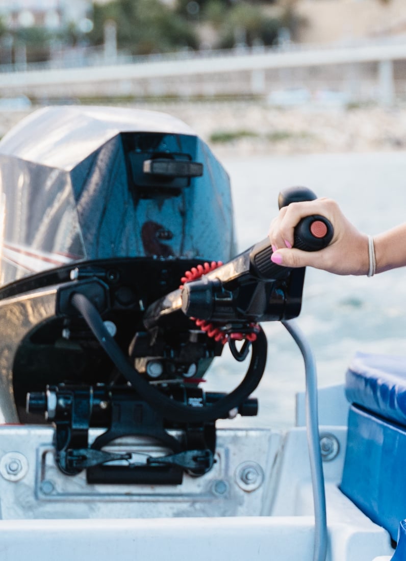 Person operating boat engine throttle control