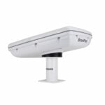 White electronic device mounted on a stand.
