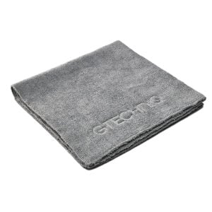 Folded gray microfiber cleaning towel with embossed logo