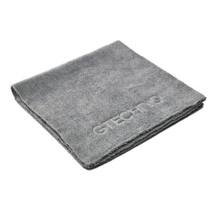 Folded gray microfiber towel with embossed logo