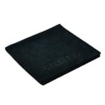 Folded black textured napkin with embossed logo