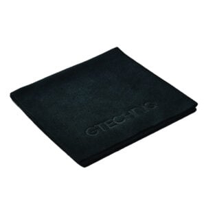 Folded black textured exercise mat with logo
