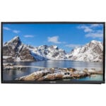 Flat-screen TV displaying snowy mountain fjord landscape