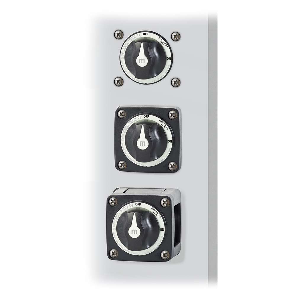 Three industrial rotary power switches on panel
