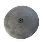 Circular zinc anode with bolt for corrosion protection.