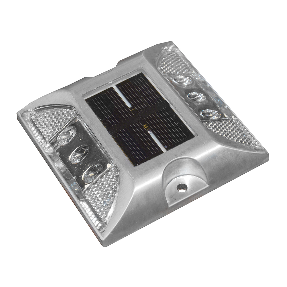 Solar-powered LED road stud with reflective panels.