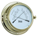 Brass analog barometer with temperature and humidity dials