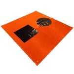 Orange tarp with black patch and circular vent