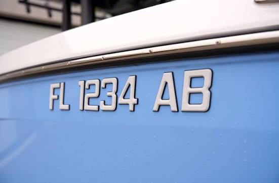 Boat registration number FL 1234 AB on blue hull