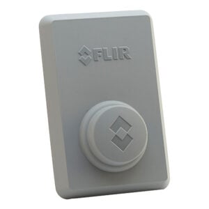 Gray FLIR-branded rectangular device with circular raised emblem